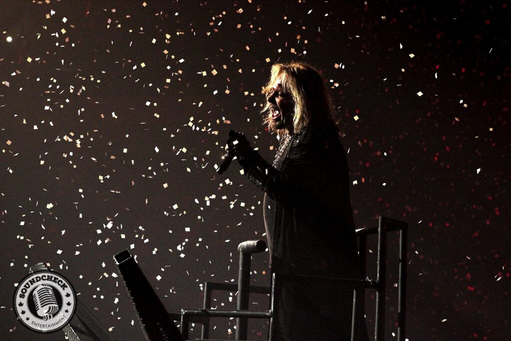 Vince Neil surrounded by ticker tape photo by -Jason Marshall for Sound Check Entertainment
