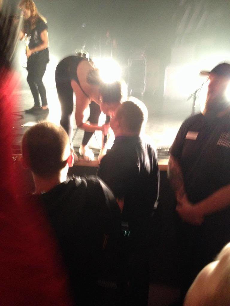 Leah kisses Leigh's hand at the July Talk Halloween show at Algonquin Commons Theatre